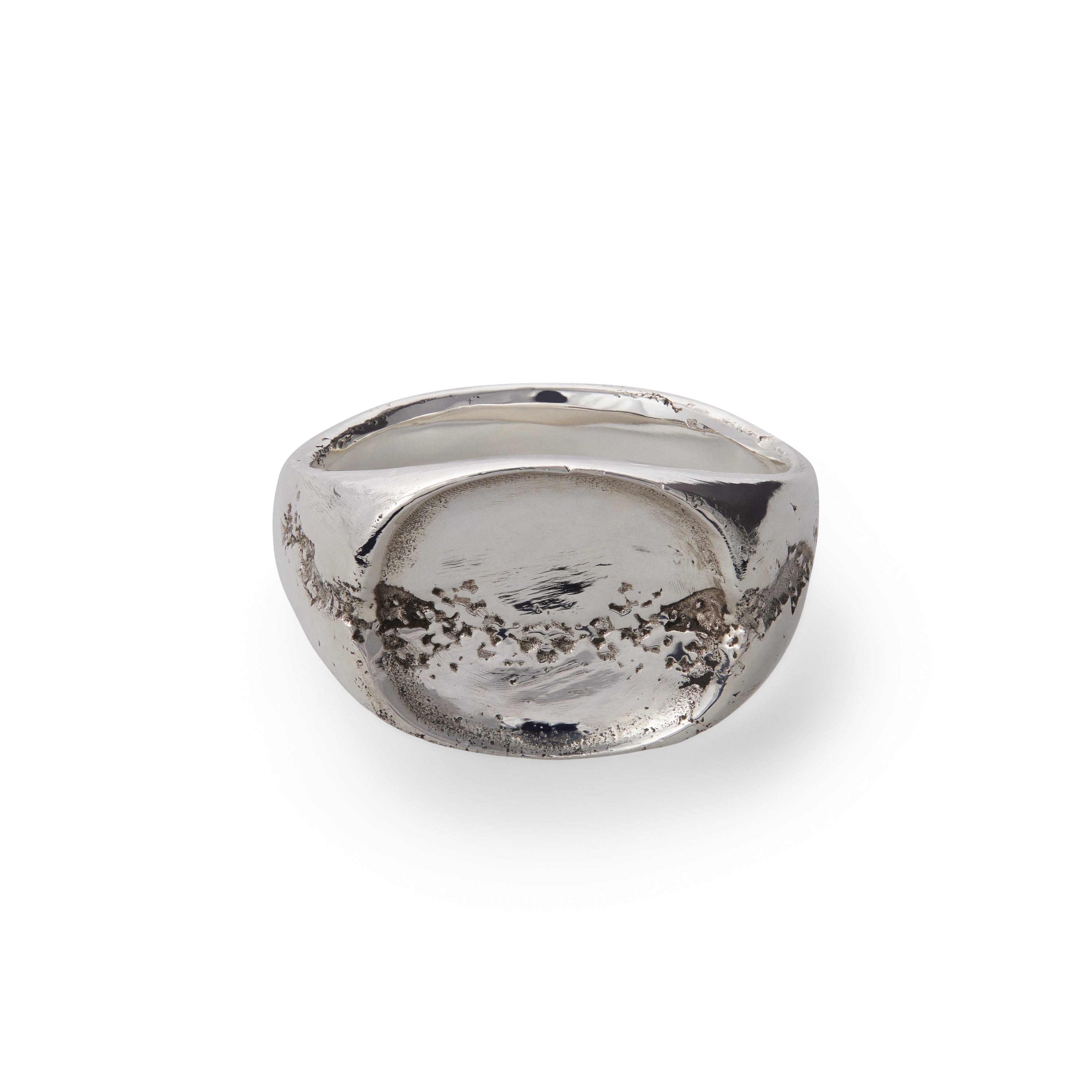 Silver ring with a textured surface on a white background